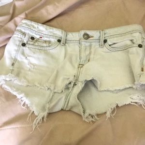 Distressed light blue jean shorts